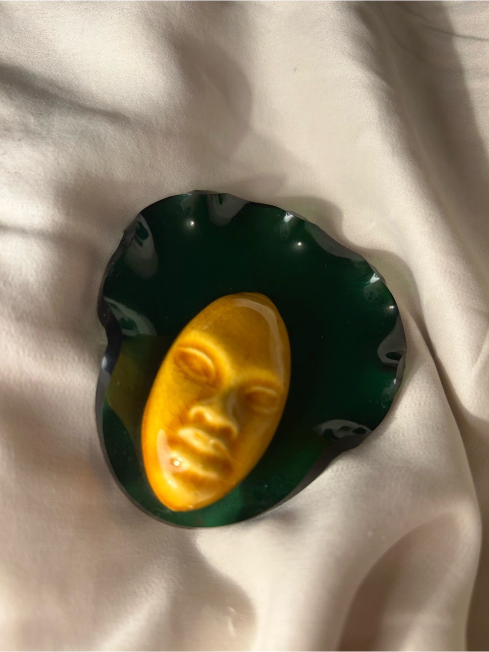 Vintage 1940s or 1950s ceramic face on lucite pin.